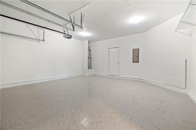 3382 Galleon Dr, Alpharetta, GA 30004 - garage featuring electric panel, a garage door opener, and baseboards