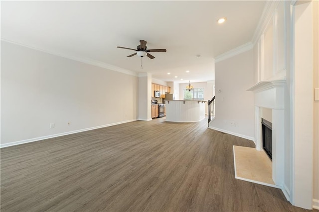 3382 Galleon Dr, Alpharetta, GA 30004 - unfurnished living room featuring ceiling fan, dark wood-style flooring, a chandelier, a glass covered fireplace, and baseboards