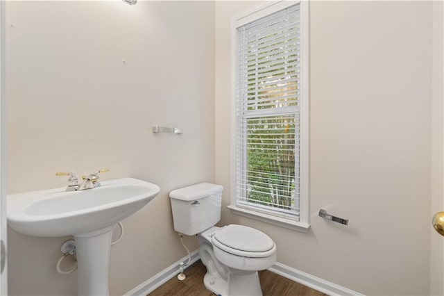 3382 Galleon Dr, Alpharetta, GA 30004 - half bath featuring baseboards, wood finished floors, toilet, and a sink