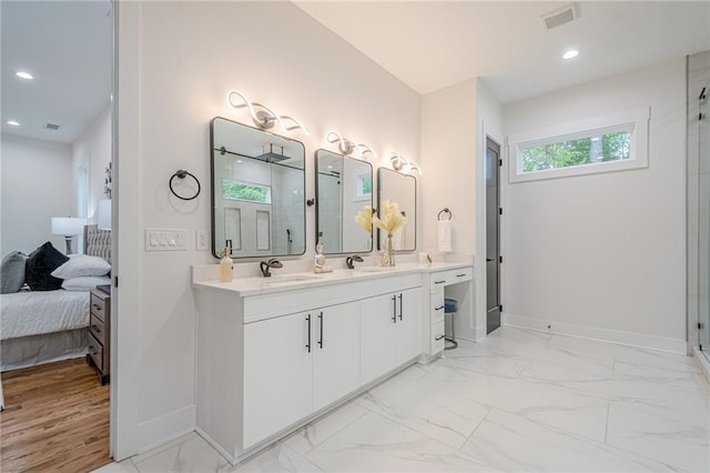 1273 Grayson Pkwy, Grayson, GA 30017 - ensuite bathroom with baseboards, a stall shower, marble finish flooring, vanity, and recessed lighting