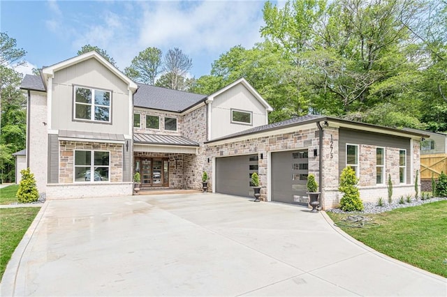 1273 Grayson Pkwy, Grayson, GA 30017 - view of front of house featuring a garage, a standing seam roof, concrete driveway, and stone siding