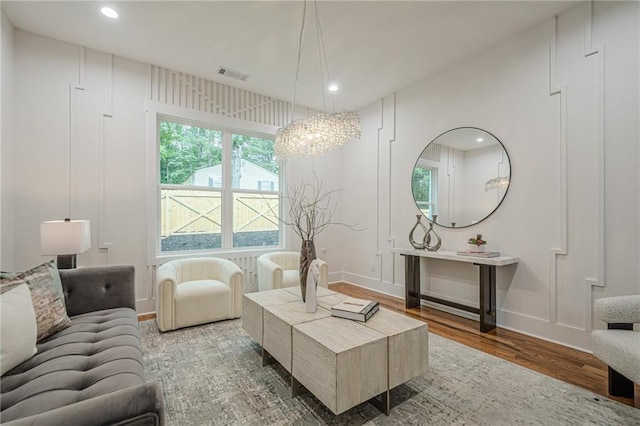 1273 Grayson Pkwy, Grayson, GA 30017 - living room featuring wood finished floors, recessed lighting, a chandelier, and baseboards