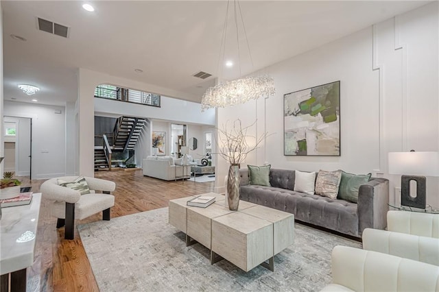 1273 Grayson Pkwy, Grayson, GA 30017 - living area with wood finished floors, stairs, recessed lighting, and a chandelier