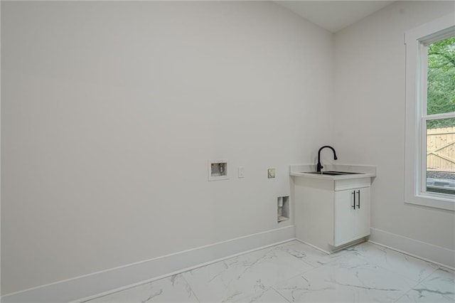 1273 Grayson Pkwy, Grayson, GA 30017 - laundry room with light marble finish flooring, baseboards, washer hookup, and cabinet space