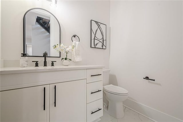1273 Grayson Pkwy, Grayson, GA 30017 - bathroom featuring marble finish floors, toilet, baseboards, and vanity