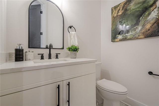 1273 Grayson Pkwy, Grayson, GA 30017 - bathroom with toilet, vanity, and baseboards