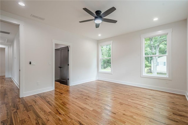 1273 Grayson Pkwy, Grayson, GA 30017 - unfurnished room featuring plenty of natural light, wood finished floors, ceiling fan, and recessed lighting