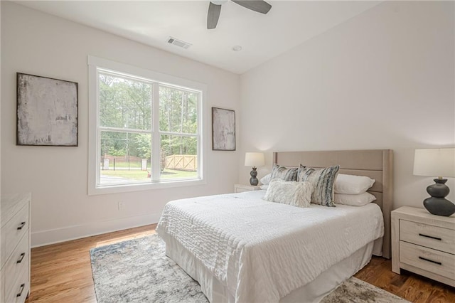 1273 Grayson Pkwy, Grayson, GA 30017 - bedroom featuring multiple windows, wood finished floors, baseboards, and ceiling fan