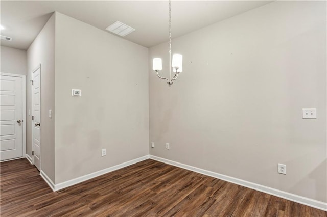 2111 Wesson Ct, Kennesaw, GA 30144 - unfurnished dining area with baseboards, dark wood-style floors, and a chandelier