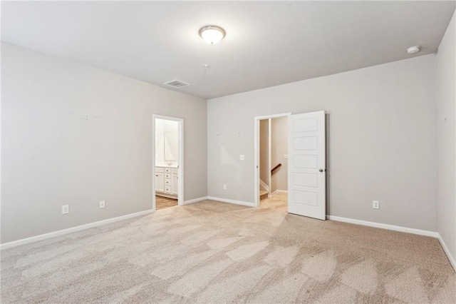 2111 Wesson Ct, Kennesaw, GA 30144 - unfurnished bedroom with carpet floors, baseboards, and ensuite bath
