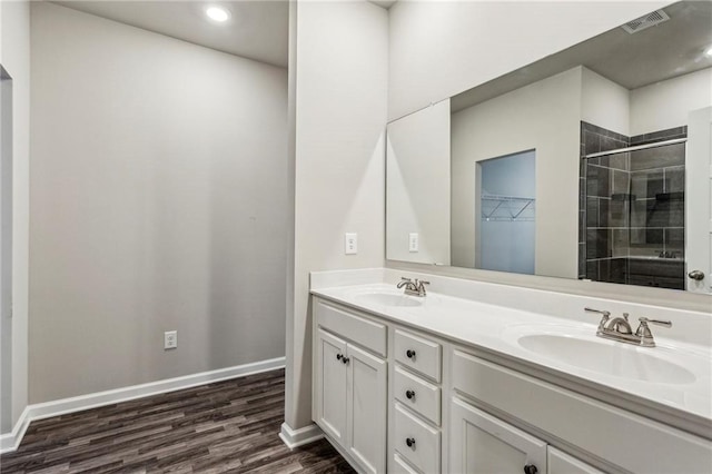 2111 Wesson Ct, Kennesaw, GA 30144 - bathroom with a stall shower, double vanity, wood finished floors, baseboards, and recessed lighting