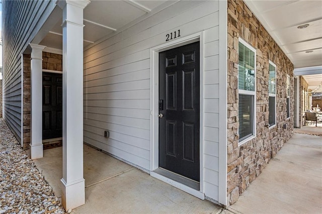 2111 Wesson Ct, Kennesaw, GA 30144 - entrance to property featuring stone siding and a porch