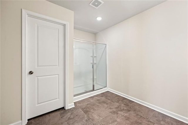 full bath featuring a stall shower, visible vents, baseboards, and recessed lighting