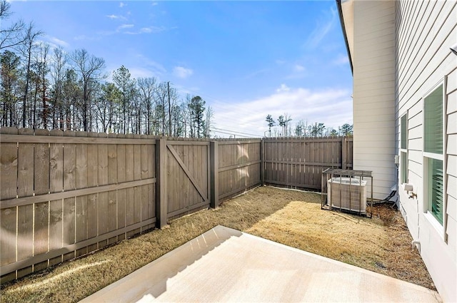 view of patio / terrace with a fenced backyard and central air condition unit