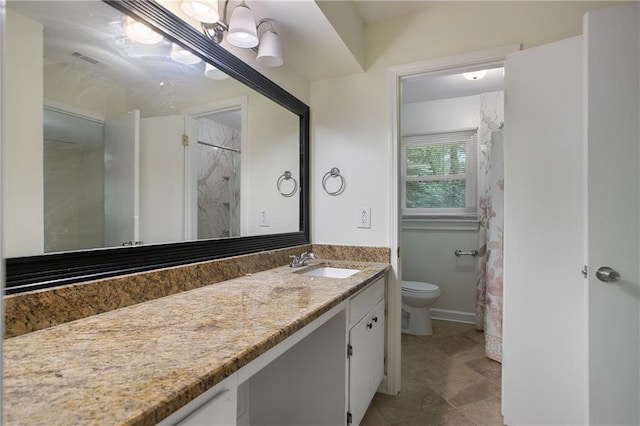 full bathroom with toilet, vanity, and a shower with shower curtain