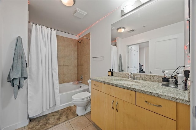 full bath featuring shower / bath combo, tile patterned floors, vanity, toilet, and visible vents