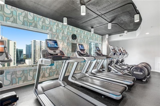 workout area featuring a city view and visible vents