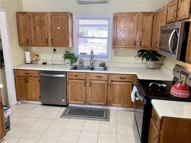 kitchen featuring black / electric stove, dishwashing machine, sink, and light tile patterned floors