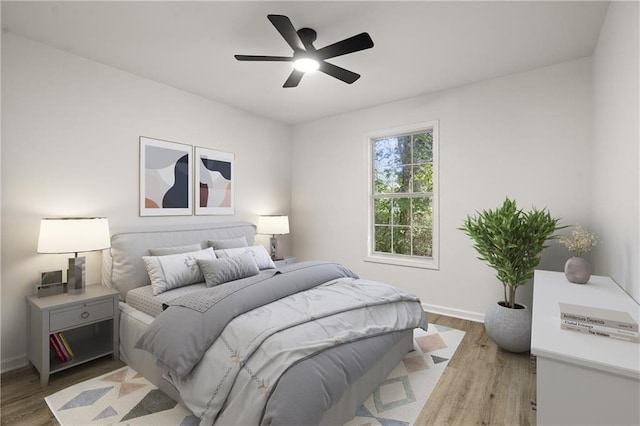 3765 Michaels Way, Cumming, GA 30040 - bedroom with baseboards, a ceiling fan, and light wood-style floors