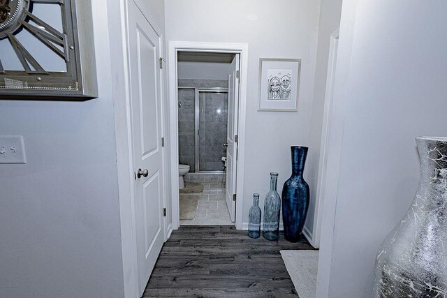 stairway featuring wood-type flooring