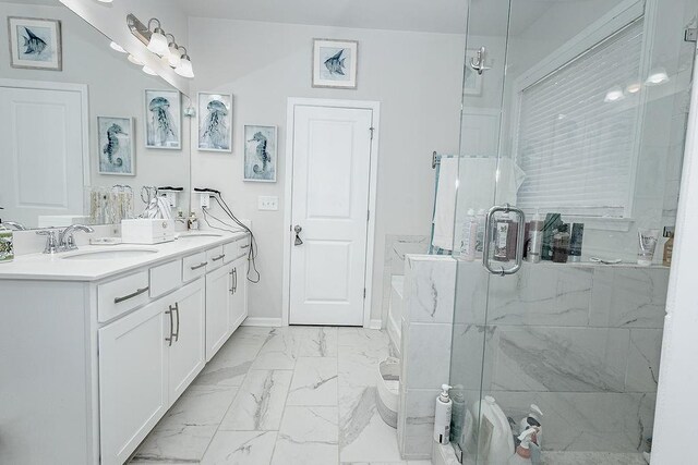 bathroom with vanity and an enclosed shower