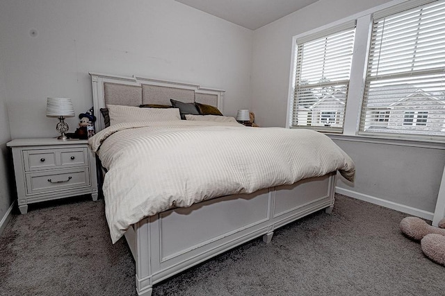 bedroom with carpet floors and baseboards