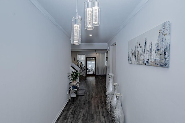 hall featuring stairway, crown molding, baseboards, and wood finished floors