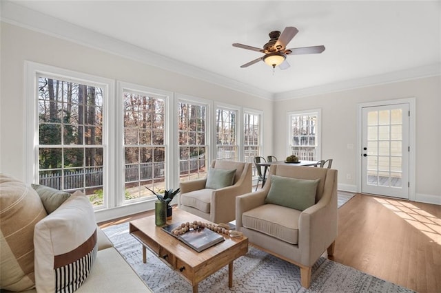 sunroom / solarium with ceiling fan