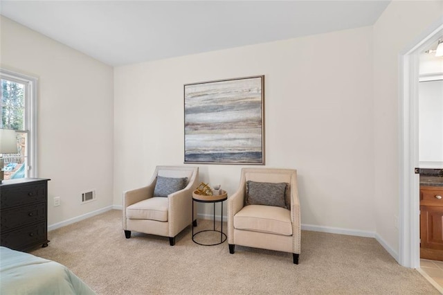 carpeted bedroom with connected bathroom