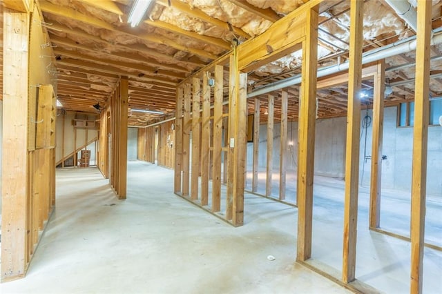miscellaneous room featuring unfinished concrete flooring