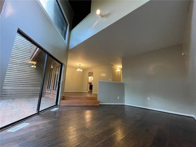 2449 Terrace Trl, Decatur, GA 30035 - unfurnished room featuring wood finished floors, a chandelier, and baseboards