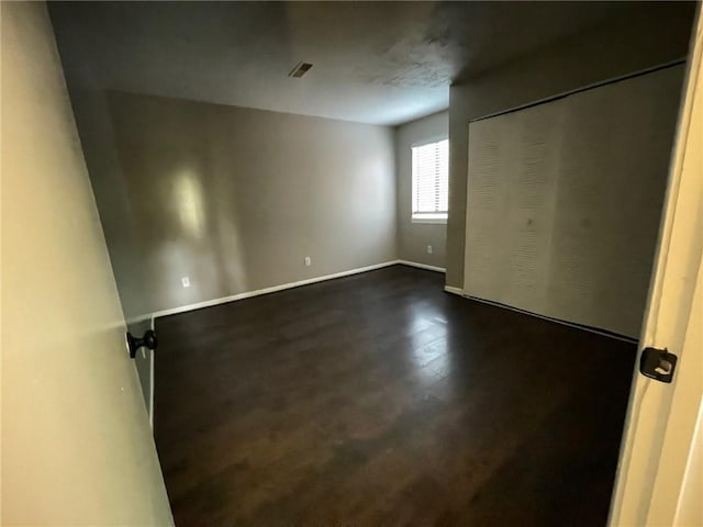 2449 Terrace Trl, Decatur, GA 30035 - unfurnished bedroom with baseboards and dark wood finished floors