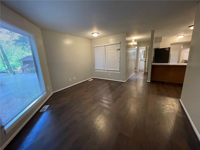 2449 Terrace Trl, Decatur, GA 30035 - unfurnished living room featuring baseboards and dark wood-type flooring