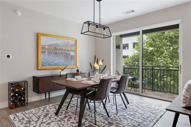 22 Airline St NE Unit 201, Atlanta, GA 30312 - dining room featuring light wood-type flooring and baseboards