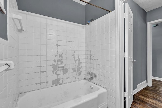 1911 Rosewood Rd, Decatur, GA 30032 - full bathroom with bathing tub / shower combination, wood finished floors, and baseboards