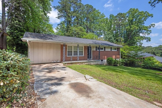 1911 Rosewood Rd, Decatur, GA 30032 - ranch-style house featuring a front yard, driveway, brick siding, and covered porch