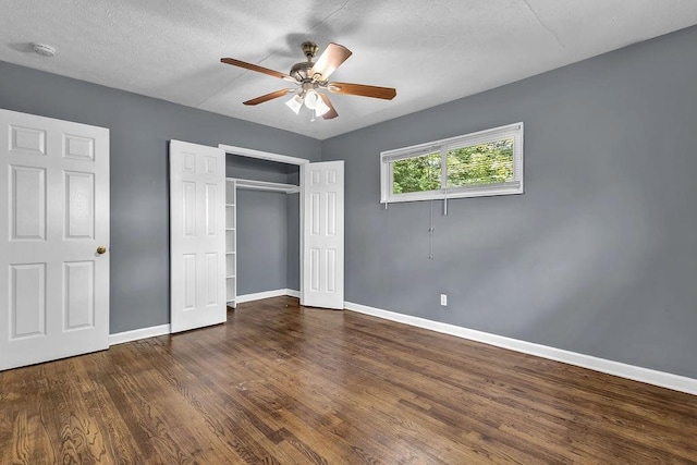 1911 Rosewood Rd, Decatur, GA 30032 - unfurnished bedroom with baseboards, wood finished floors, a closet, ceiling fan, and a textured ceiling