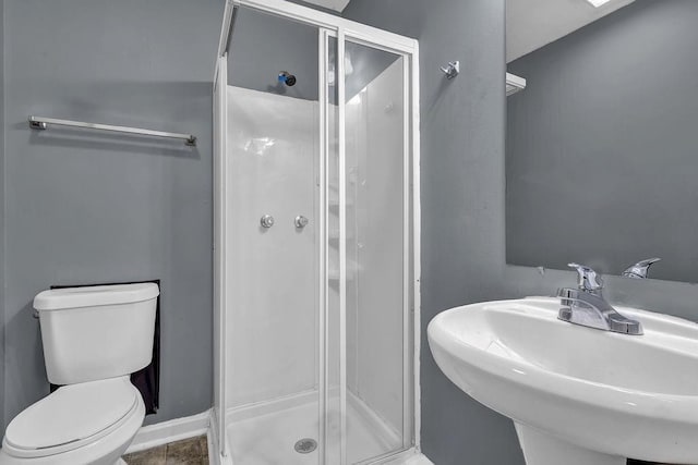 1911 Rosewood Rd, Decatur, GA 30032 - bathroom featuring a sink, a shower stall, toilet, and tile patterned flooring