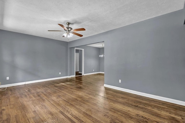 1911 Rosewood Rd, Decatur, GA 30032 - spare room featuring ceiling fan, wood finished floors, a textured ceiling, baseboards, and a chandelier