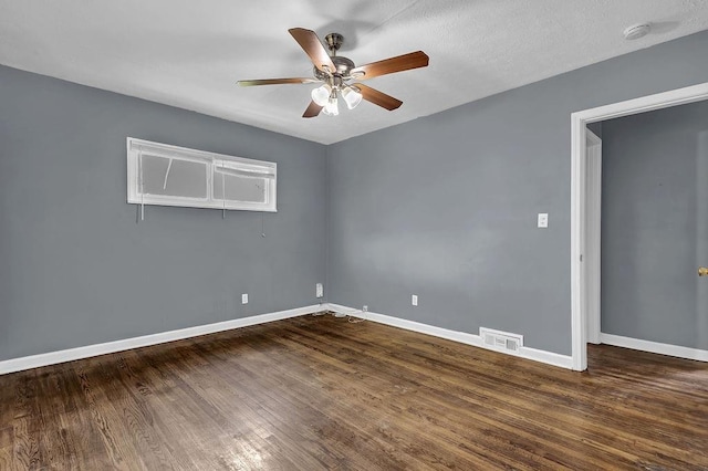 1911 Rosewood Rd, Decatur, GA 30032 - unfurnished room with a ceiling fan, baseboards, dark wood-style flooring, and a smoke detector