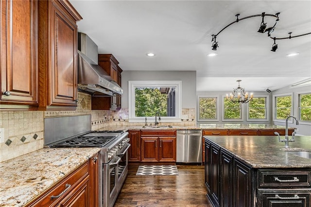 kitchen with stainless steel appliances, sink, and a wealth of natural light