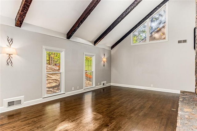 unfurnished living room with dark wood-type flooring and vaulted ceiling with beams