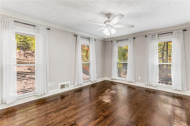 unfurnished room featuring crown molding, ceiling fan, hardwood / wood-style floors, and a textured ceiling