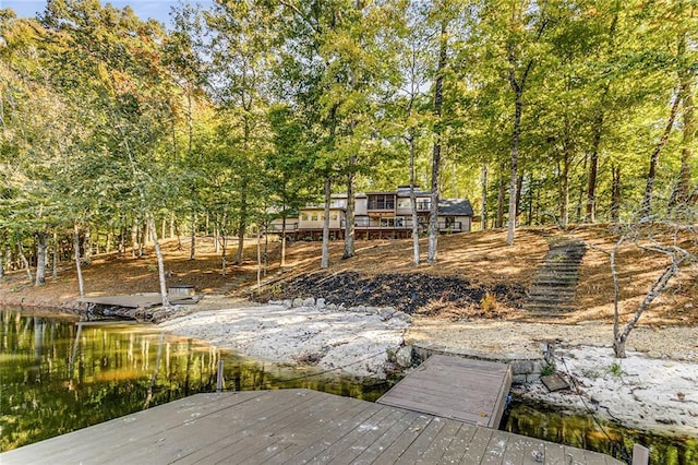 exterior space featuring a water view and a boat dock