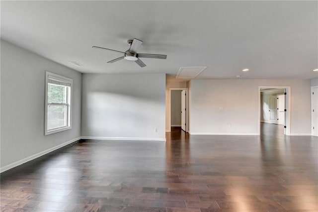 empty room with a ceiling fan, recessed lighting, dark wood finished floors, and attic access