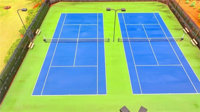 view of sport court with fence