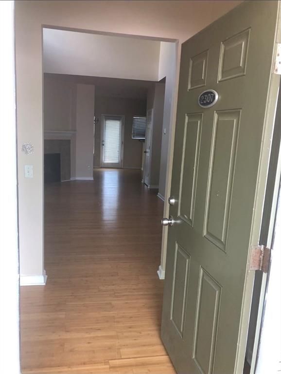 hallway with light wood-type flooring