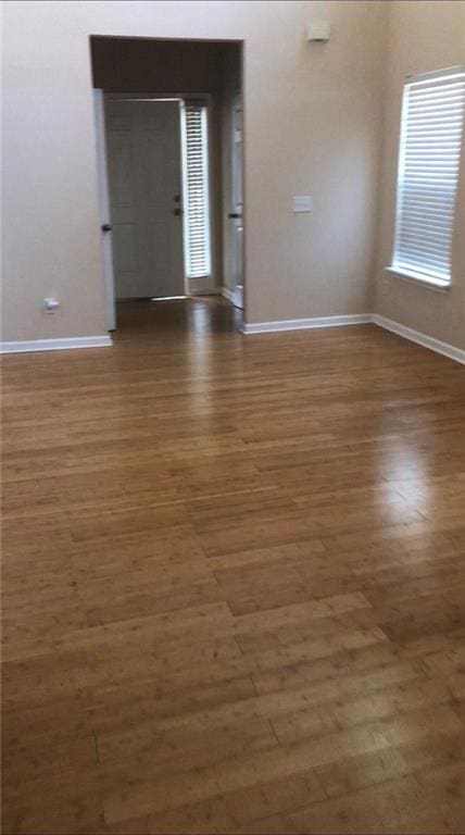 empty room featuring dark wood-type flooring