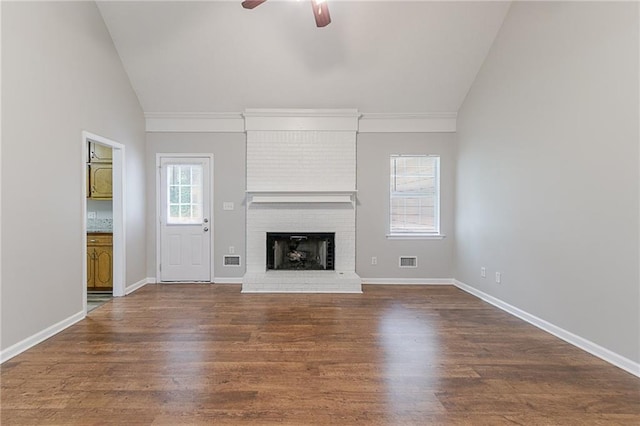 260 Pleasant Grove Cir, Mcdonough, GA 30252 - unfurnished living room featuring lofted ceiling, ceiling fan, wood finished floors, a brick fireplace, and baseboards