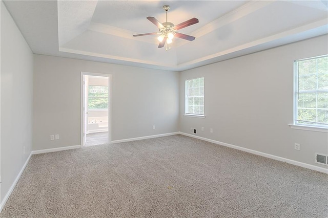 260 Pleasant Grove Cir, Mcdonough, GA 30252 - carpeted spare room featuring a tray ceiling, ceiling fan, and baseboards